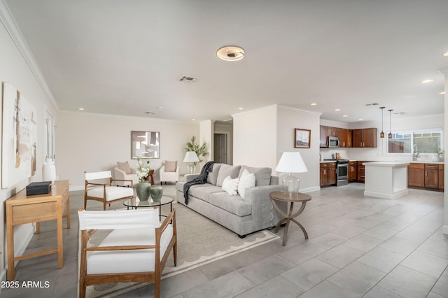 tiled living room featuring ornamental molding and sink