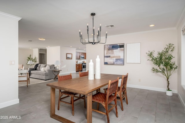 dining area with ornamental molding and a chandelier