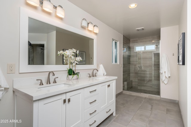 bathroom with an enclosed shower and vanity