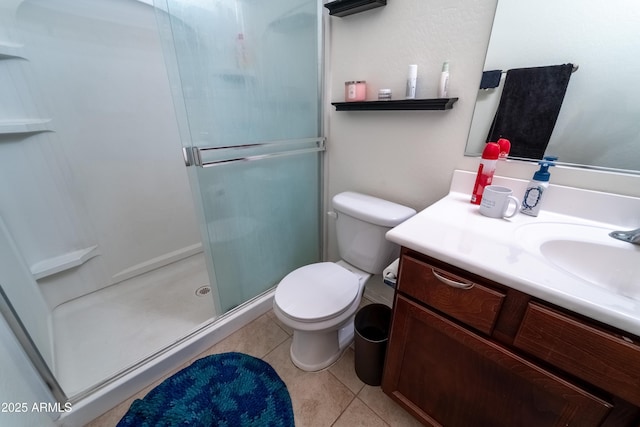 24349 W Gregory Rd, Buckeye, AZ 85326 - bathroom featuring tile patterned floors, vanity, a shower stall, and toilet