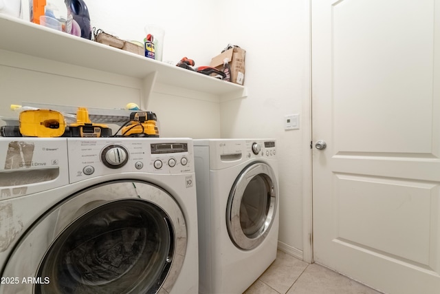 24349 W Gregory Rd, Buckeye, AZ 85326 - laundry area featuring independent washer and dryer, light tile patterned floors, and laundry area