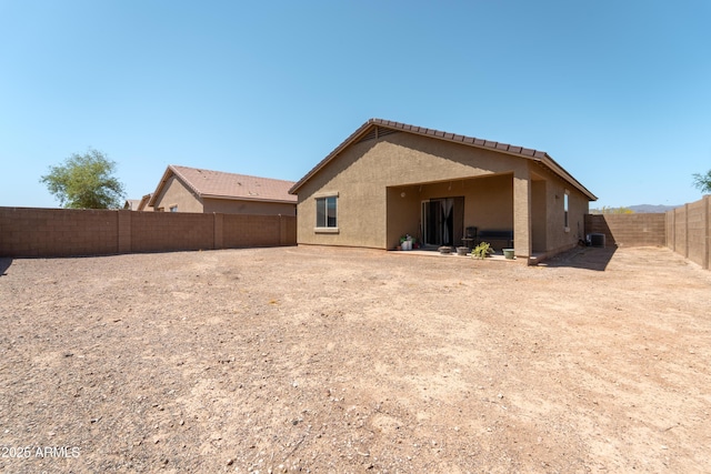 24349 W Gregory Rd, Buckeye, AZ 85326 - rear view of property with a fenced backyard, central air condition unit, and stucco siding