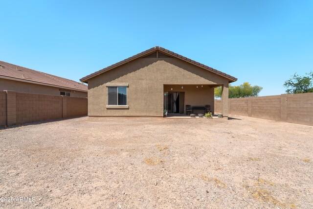 24349 W Gregory Rd, Buckeye, AZ 85326 - back of house with stucco siding and a fenced backyard