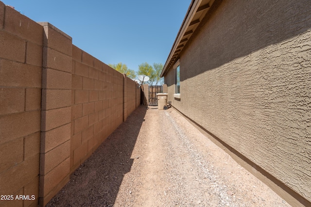 24349 W Gregory Rd, Buckeye, AZ 85326 - view of property exterior featuring stucco siding and fence