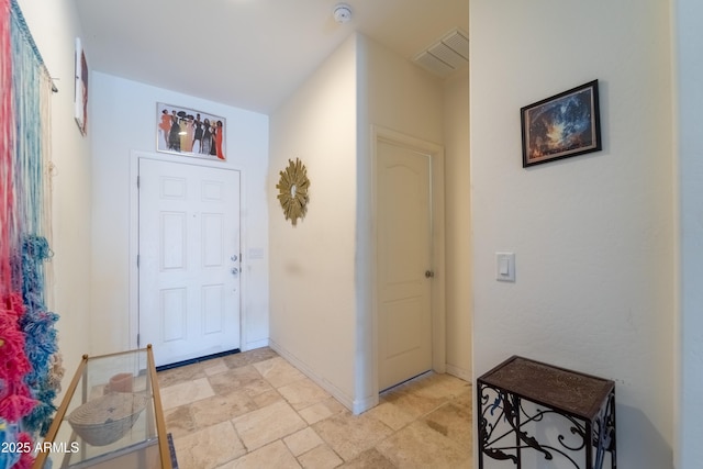24349 W Gregory Rd, Buckeye, AZ 85326 - entrance foyer with baseboards and stone finish floor