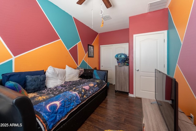 24349 W Gregory Rd, Buckeye, AZ 85326 - bedroom with wood finished floors, visible vents, and a ceiling fan