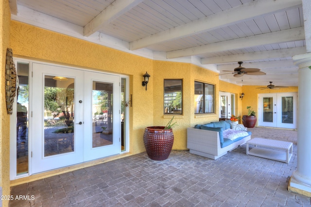 view of patio featuring ceiling fan and french doors