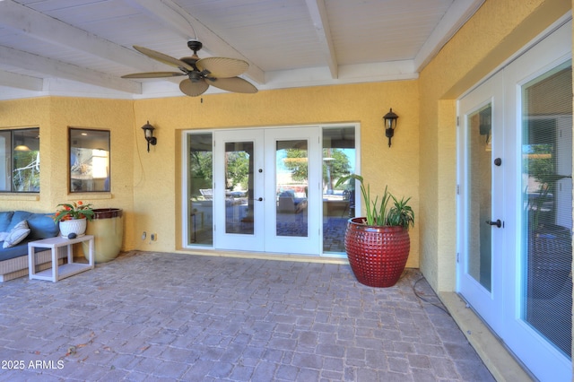 exterior space featuring ceiling fan and french doors