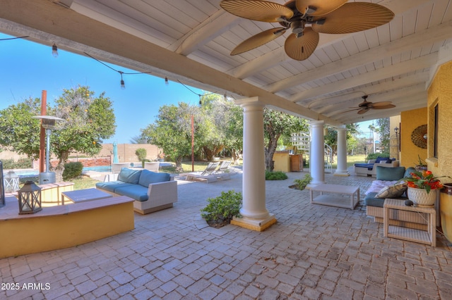 view of patio with ceiling fan and outdoor lounge area