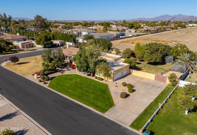 birds eye view of property with a mountain view