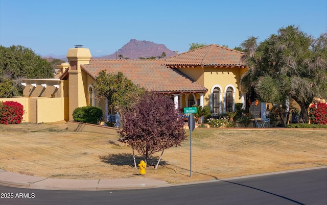 mediterranean / spanish-style house featuring a mountain view