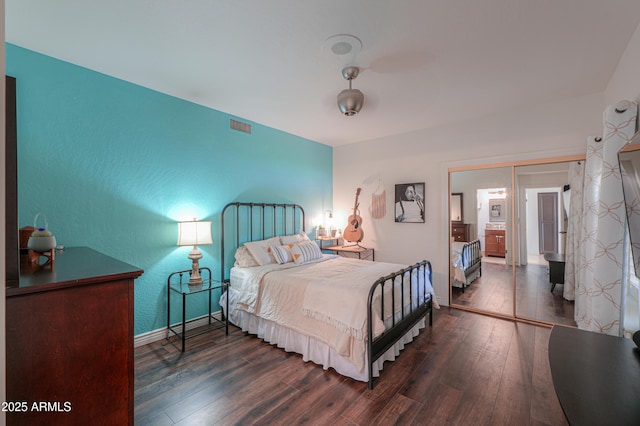 bedroom with dark wood-type flooring