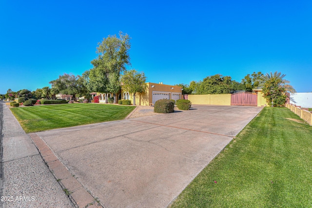 view of front of house featuring a front yard and a garage