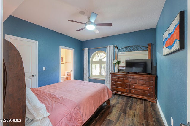 bedroom with ceiling fan, dark wood-type flooring, and ensuite bathroom