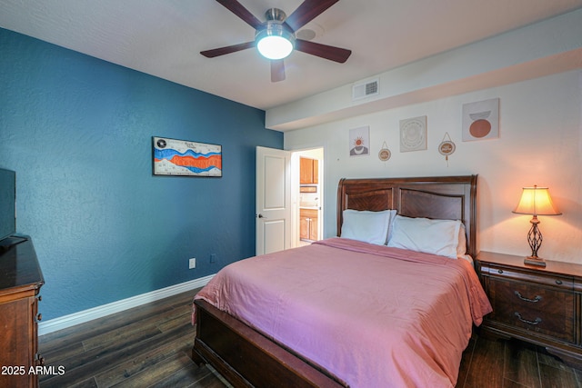 bedroom with ceiling fan and dark wood-type flooring