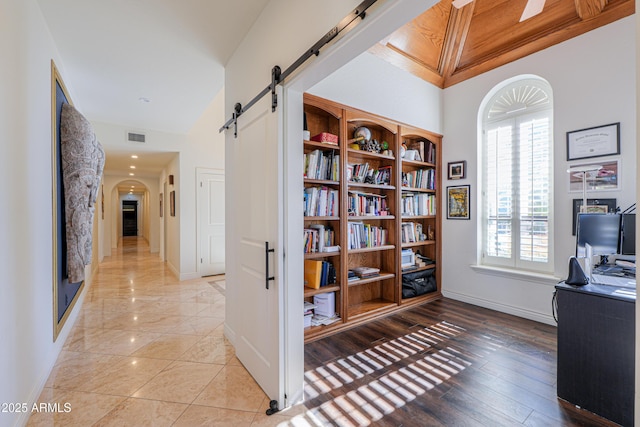 home office featuring a barn door