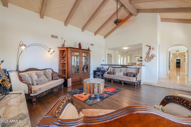 living room featuring high vaulted ceiling, beam ceiling, dark hardwood / wood-style flooring, and wooden ceiling