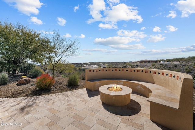 view of patio / terrace featuring a fire pit