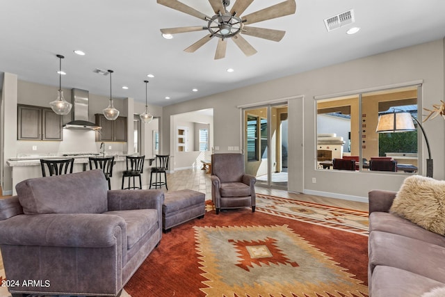 living room featuring visible vents, recessed lighting, and baseboards