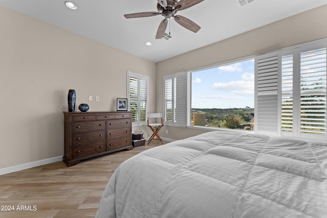 bedroom featuring ceiling fan and light hardwood / wood-style flooring