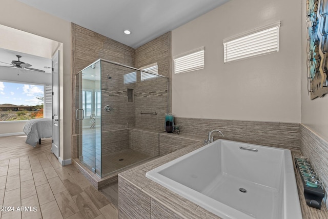 full bathroom featuring a shower stall, tiled tub, wood tiled floor, ensuite bathroom, and a ceiling fan