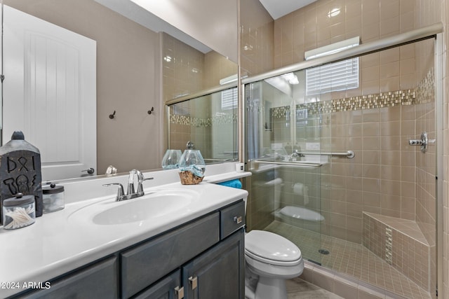 bathroom featuring a shower with door, toilet, tile patterned floors, and vanity