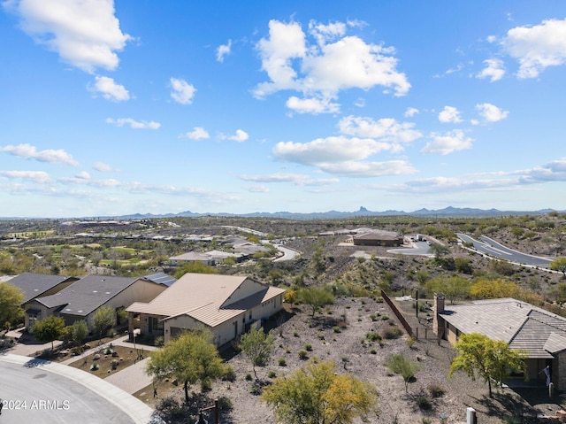 drone / aerial view featuring a residential view and a mountain view