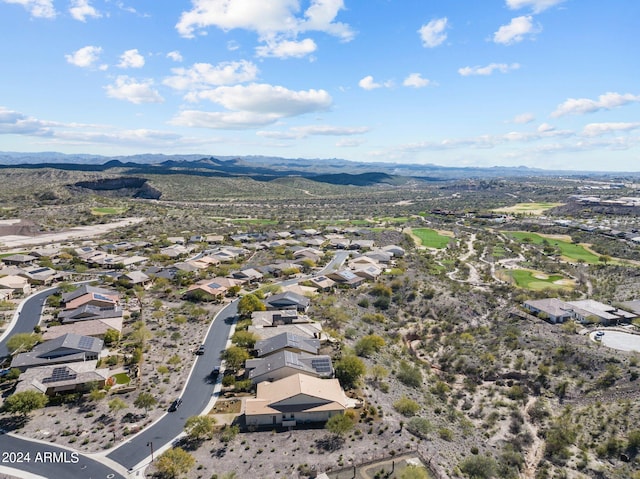 birds eye view of property with a mountain view