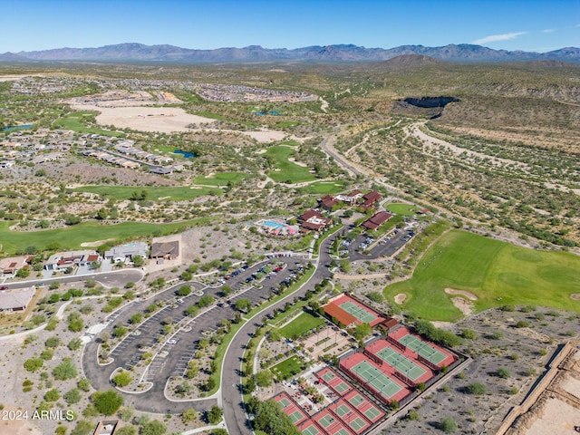 birds eye view of property with a mountain view and golf course view