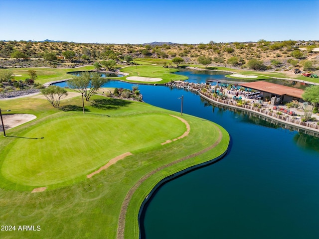 bird's eye view featuring a water view and view of golf course