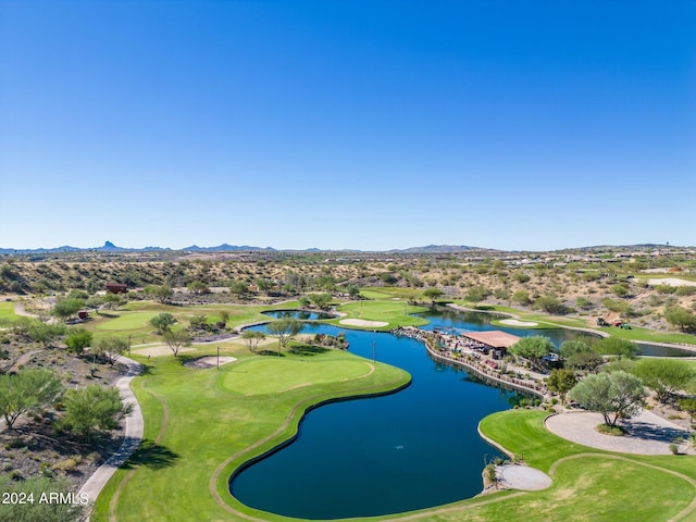 birds eye view of property featuring golf course view and a water and mountain view