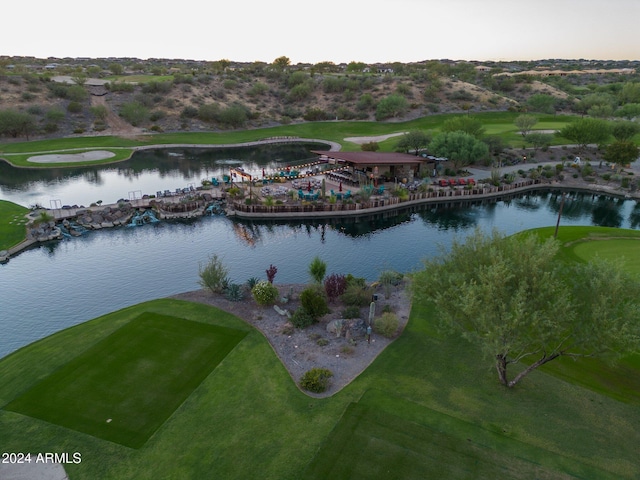 aerial view at dusk with a water view