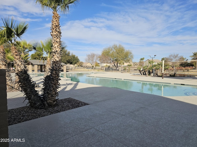 view of swimming pool featuring a patio area