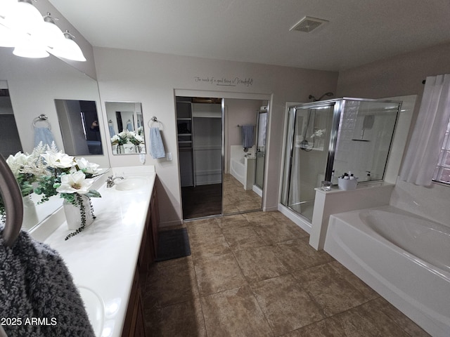 bathroom featuring vanity and plus walk in shower