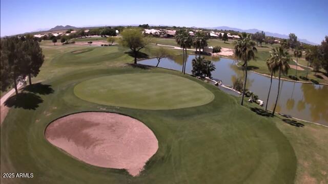 view of community with a water view and golf course view