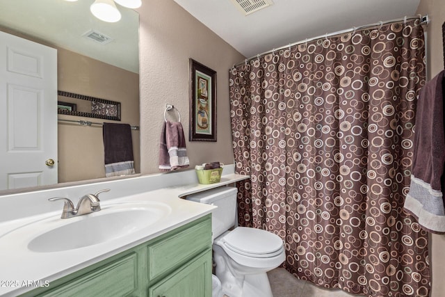 full bathroom with visible vents, vanity, toilet, and tile patterned floors