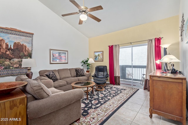 living area with a ceiling fan, high vaulted ceiling, and light tile patterned floors