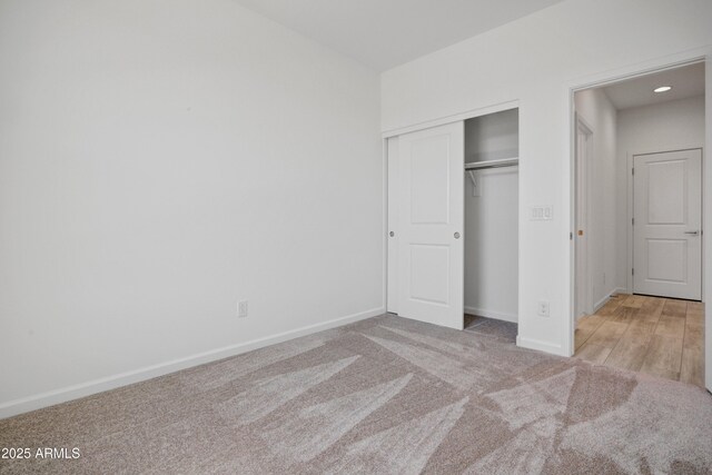 4515 Charro Ct, Wickenburg, AZ 85390 - unfurnished bedroom with carpet flooring, a closet, baseboards, and recessed lighting