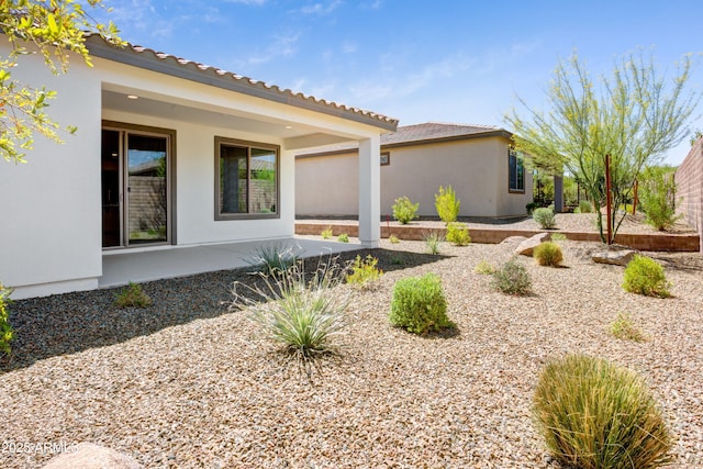 4515 Charro Ct, Wickenburg, AZ 85390 - view of home's exterior featuring stucco siding and a patio area
