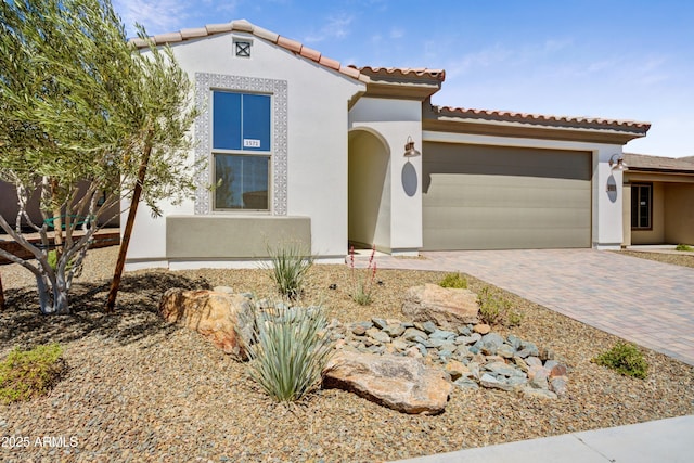 4515 Charro Ct, Wickenburg, AZ 85390 - mediterranean / spanish-style home featuring stucco siding, an attached garage, decorative driveway, and a tile roof