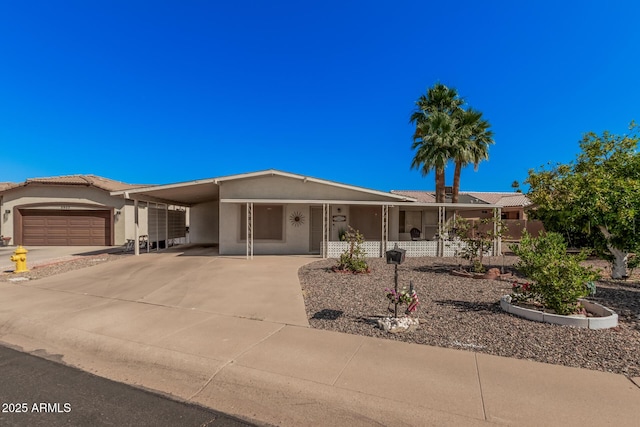 5808 E Lawndale St, Mesa, AZ 85215 - view of front of house with driveway, stucco siding, a carport, and a porch