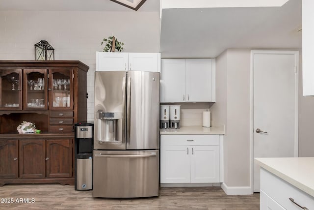 5808 E Lawndale St, Mesa, AZ 85215 - kitchen with stainless steel fridge, light wood-style flooring, light countertops, and white cabinets