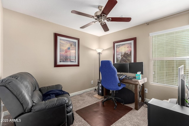 carpeted home office with baseboards, a healthy amount of sunlight, and a ceiling fan