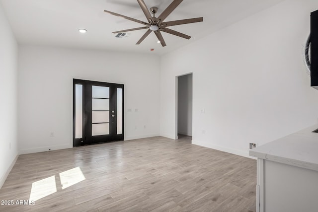 unfurnished living room featuring recessed lighting, baseboards, ceiling fan, visible vents, and light wood-style floors