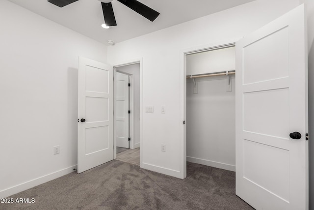 unfurnished bedroom with baseboards, a closet, ceiling fan, and carpet floors