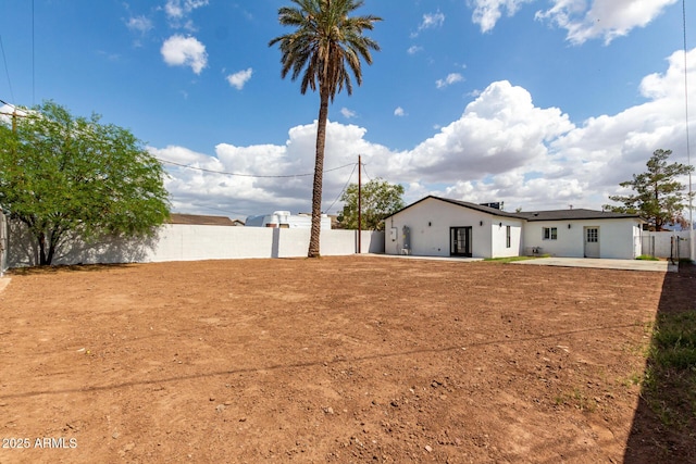 view of yard featuring a patio and fence