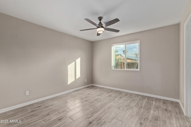 empty room featuring ceiling fan and light hardwood / wood-style flooring