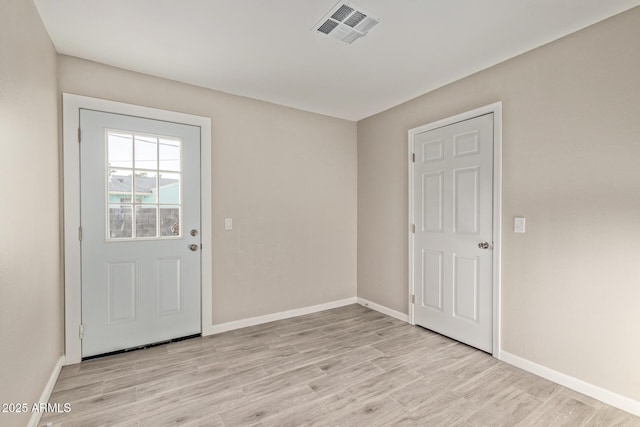 entryway with light hardwood / wood-style flooring