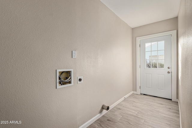 clothes washing area featuring washer hookup, hookup for an electric dryer, and light hardwood / wood-style floors