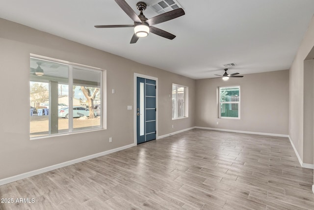 spare room with light wood-type flooring